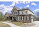 Beautiful two-story brick and stone home with a covered porch and well-maintained landscaping at 2845 Echols Rd, Cumming, GA 30041