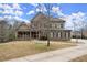 Attractive two-story home with stone and brick accents, and a concrete driveway at 2845 Echols Rd, Cumming, GA 30041