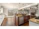 Spacious kitchen with granite countertops, stainless steel appliances, large windows and hardwood floors at 2845 Echols Rd, Cumming, GA 30041
