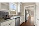 Modern kitchen with white cabinetry, granite countertops, and stainless steel appliances at 2845 Echols Rd, Cumming, GA 30041