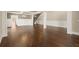 Open-concept living room with hardwood floors, coffered ceiling, and staircase at 2845 Echols Rd, Cumming, GA 30041