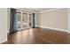 Bright living room features hardwood floors, large windows, and custom drapes at 2845 Echols Rd, Cumming, GA 30041