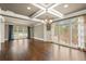 Spacious living room featuring hardwood floors, large windows, and stylish curtains at 2845 Echols Rd, Cumming, GA 30041