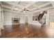 Elegant living room with coffered ceiling, fireplace, built-in shelves, and a staircase at 2845 Echols Rd, Cumming, GA 30041