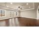 Open-concept living room boasts hardwood floors, recessed lighting, and French doors to the backyard at 2845 Echols Rd, Cumming, GA 30041