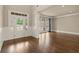 Inviting living room with hardwood floors, large windows, and wainscoting at 2845 Echols Rd, Cumming, GA 30041