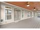 Inviting screened porch with stylish ceiling fans, multiple entry points, and a spacious area for entertaining and relaxing at 2845 Echols Rd, Cumming, GA 30041