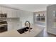 Kitchen with white cabinetry, stainless steel appliances, subway tile backsplash, and quartz countertops at 3175 Justice Mill Nw Ct, Kennesaw, GA 30144