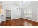 Dining area featuring chandelier lighting, hardwood floors, and large window with shutters at 3310 Raes Creek Rd # 16, Marietta, GA 30008