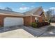 Brick house with a two-car garage and professionally landscaped yard at 3310 Raes Creek Rd # 16, Marietta, GA 30008