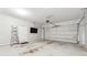 Spacious two-car garage with an automatic door, ladder, and TV at 3310 Raes Creek Rd # 16, Marietta, GA 30008