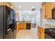 Bright eat-in kitchen with wood cabinets, granite counters and stainless steel appliances at 3310 Raes Creek Rd # 16, Marietta, GA 30008