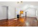 Open living area with hardwood floors, fireplace, leading to kitchen with breakfast bar at 3310 Raes Creek Rd # 16, Marietta, GA 30008