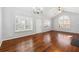 Spacious living area featuring hardwood floors, plantation shutters, and great natural light at 3310 Raes Creek Rd # 16, Marietta, GA 30008