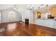 Open living space with fireplace, hardwood floors, leading to kitchen with breakfast bar at 3310 Raes Creek Rd # 16, Marietta, GA 30008