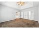 Spacious main bedroom with a tray ceiling, ceiling fan, multiple closets and ensuite bathroom access at 3310 Raes Creek Rd # 16, Marietta, GA 30008