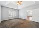 Spacious main bedroom with a tray ceiling, ceiling fan, and ensuite bathroom access at 3310 Raes Creek Rd # 16, Marietta, GA 30008