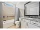 Well-appointed bathroom featuring granite counters, vanity, and a shower-tub combination at 410 Windy Ridge Way, Canton, GA 30114