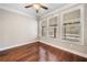 Bedroom with hardwood floors and natural light streaming through the windows at 410 Windy Ridge Way, Canton, GA 30114