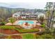 Stunning community pool surrounded by lush landscaping in a beautiful neighborhood at 410 Windy Ridge Way, Canton, GA 30114