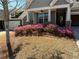 Inviting front yard with blooming azaleas adding vibrant color to the landscape at 410 Windy Ridge Way, Canton, GA 30114