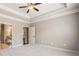 Spacious main bedroom with a ceiling fan, walk-in closets, and a ensuite bathroom at 410 Windy Ridge Way, Canton, GA 30114