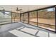 Enjoy this screened porch with ceiling fan, outdoor access, and wooded view at 410 Windy Ridge Way, Canton, GA 30114