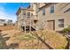 Backyard featuring a screened-in porch, deck, and stairs leading to the yard at 257 Lakestone Pkwy, Woodstock, GA 30188