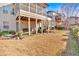 Backyard featuring a well-maintained yard, a screened-in porch, and stairs at 257 Lakestone Pkwy, Woodstock, GA 30188