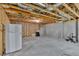 Unfinished basement space showing exposed beams and ductwork, concrete floor, and insulated walls ready for customization at 257 Lakestone Pkwy, Woodstock, GA 30188