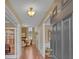 Elegant foyer showcasing an open floor plan leading into a cozy living room with stone fireplace at 257 Lakestone Pkwy, Woodstock, GA 30188