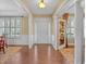 Elegant foyer with hardwood floors and ample natural light, offering a grand entrance at 257 Lakestone Pkwy, Woodstock, GA 30188
