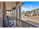 Inviting front porch with classic rocking chairs, providing a relaxing outdoor space at 257 Lakestone Pkwy, Woodstock, GA 30188