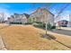 Charming home showcasing lush landscaping, a well-manicured lawn, and inviting curb appeal in a suburban neighborhood at 257 Lakestone Pkwy, Woodstock, GA 30188