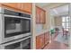 Modern kitchen features stainless steel appliances and a view into the dining room at 257 Lakestone Pkwy, Woodstock, GA 30188