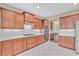 Well-lit kitchen with modern stainless steel appliances, stone counters, and lots of cabinet space at 257 Lakestone Pkwy, Woodstock, GA 30188