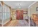 Bright and airy home office featuring plantation shutters and elegant furnishings at 257 Lakestone Pkwy, Woodstock, GA 30188