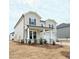 Charming two-story home featuring a welcoming front porch and classic architectural details at 2624 Mourning Dove Drive (Lot 42), Grayson, GA 30017