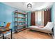 Bedroom featuring blue walls, wood floors, and natural light creates a comforting retreat at 368 Triumph Se Cir, Atlanta, GA 30354