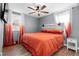 A cozy bedroom featuring gray walls, wood-look flooring, and a contemporary ceiling fan at 368 Triumph Se Cir, Atlanta, GA 30354