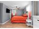 A cozy bedroom with gray walls, orange bedding, and an accent headboard create an inviting space at 368 Triumph Se Cir, Atlanta, GA 30354