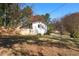 Exterior view of a home showcasing its backyard, mature trees, and well-maintained lawn at 368 Triumph Se Cir, Atlanta, GA 30354