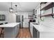 Contemporary kitchen with stainless steel appliances, white cabinets, and plenty of counter space at 368 Triumph Se Cir, Atlanta, GA 30354