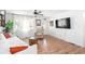 Spacious living room with large windows, hardwood floors, and a comfortable seating area at 368 Triumph Se Cir, Atlanta, GA 30354