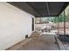 Covered patio with concrete flooring, offering an outdoor living space with mature landscaping at 368 Triumph Se Cir, Atlanta, GA 30354