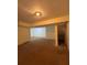 A basement space with carpeting, an overhead light, and large closet storage at 7123 Williamsburg Dr, Riverdale, GA 30274