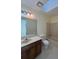Standard bathroom featuring a vanity, mirror, and a bathtub-shower combination with tiled walls at 7123 Williamsburg Dr, Riverdale, GA 30274