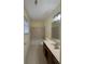 Bathroom featuring a bathtub, tiled shower, and a vanity with drawers at 7123 Williamsburg Dr, Riverdale, GA 30274