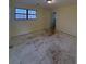 A bedroom with a window providing natural light and visible flooring at 7123 Williamsburg Dr, Riverdale, GA 30274