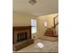 Living room with fireplace, staircase, and natural light at 7123 Williamsburg Dr, Riverdale, GA 30274